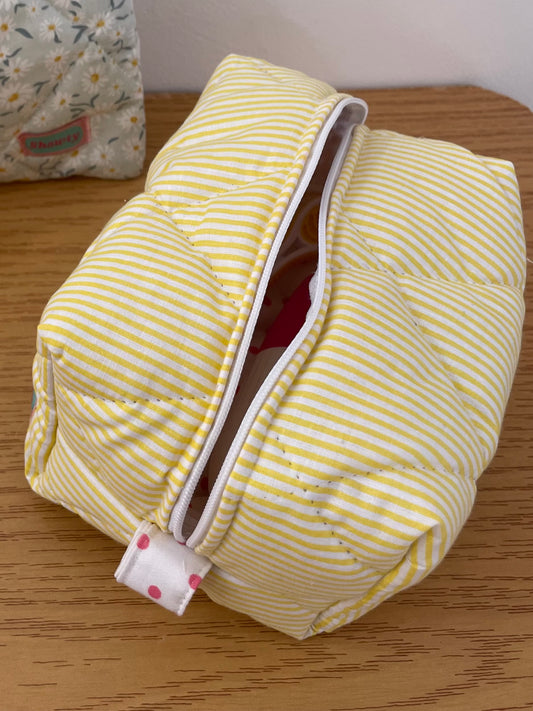 Yellow stripped pouch